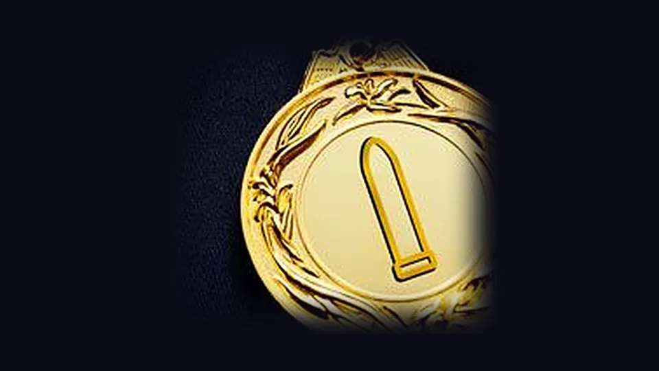A gold medal stamped with a bullet vibrator